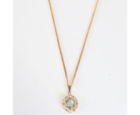 A modern 9ct gold aquamarine pendant necklace, openwork design set with oval mixed cut aqua, on 9ct fine flat curb link chain