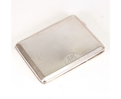 A George V Art Deco silver cigarette case, engine turned sunburst decoration, by Deykin & Harrison, hallmarks Birmingham 1929