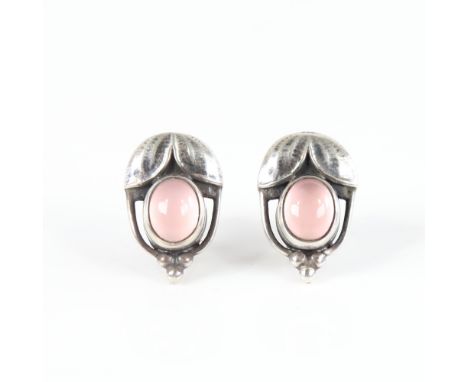 GEORG JENSEN - a Vintage Danish pair of clip earrings of the year 2003, openwork stylised sterling silver set with cabochon p