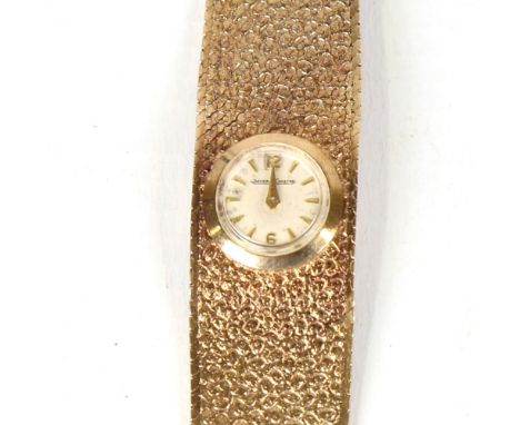 JAEGER LECOULTRE - a lady's Vintage 9ct gold mechanical wristwatch, silvered dial with half-hourly Arabic numerals and textur