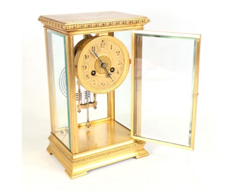 An early 20th century French gilt-brass 4-glass 8-day mantel clock, by Vincent & Cie, ornate gilt dial with Arabic numerals, 