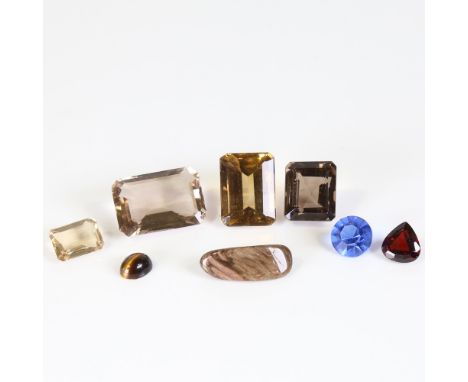 Various loose gemstones, including smoky quartz, garnet and tiger's eye, largest dimensions: 24.7 x 17.5 x 9.3mm, 21.8g total