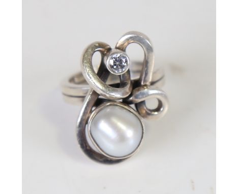 RICHARD AXEL BALLE - a modern Danish stylised sterling silver baroque pearl and cubic zirconia dress ring, setting height 26.