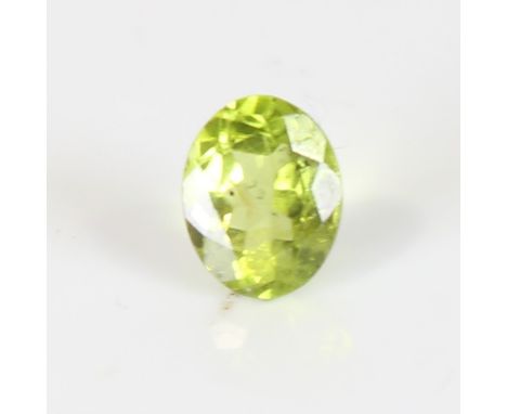 2.48ct unmounted oval mixed cut peridot, dimensions:  9.14 x 7.35 x 4.89mm, 0.50g, with IDT Gemstone ReportNo damage, some in