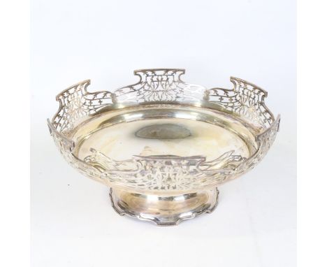 A large George V silver pedestal fruit bowl, circular form with pierced foliate gallery and stepped interior, by R F Mosley &