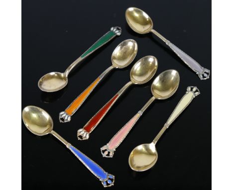 A set of 7 Scandinavian vermeil sterling silver and harlequin enamel coffee spoons, length 10cmNo damage or enamel loss, only