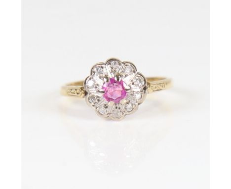 A late 20th century 18ct gold ruby and diamond cluster flowerhead ring, set with round-cut ruby and eight-cut diamonds, total