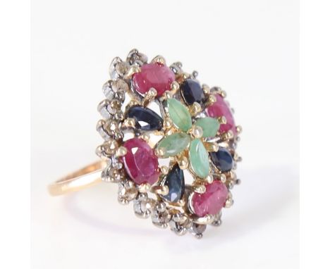 A large modern gem-set ring, set with vari-cut emerald, sapphire, ruby and diamond, with unmarked gold shank, setting height 