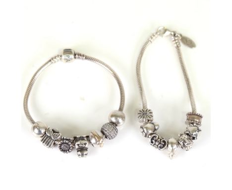 2 sterling silver snake link charm bracelets, with 14 charms and spacers, including Pandora, 66.6g total (2)No damage or repa