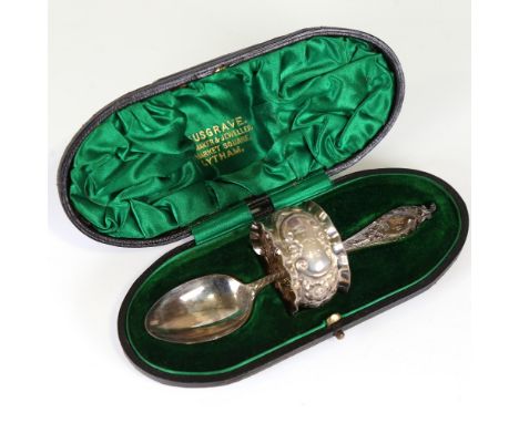 A cased Victorian silver christening set, comprising spoon and napkin ring, relief embossed foliate decoration, by James Deak