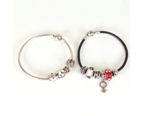 PANDORA - a sterling silver bangle charm bracelet, and a similar leather example, with 10 charms total, 42.3g total (2)No dam