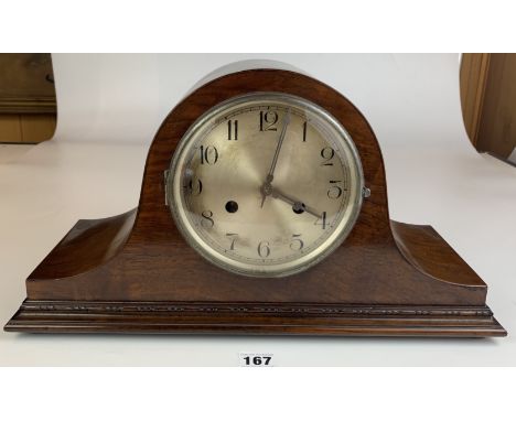 Wooden 2 hole Napoleon hat cased mantle clock with silvered dial, pendulum and key. 17” long x 9.5” high