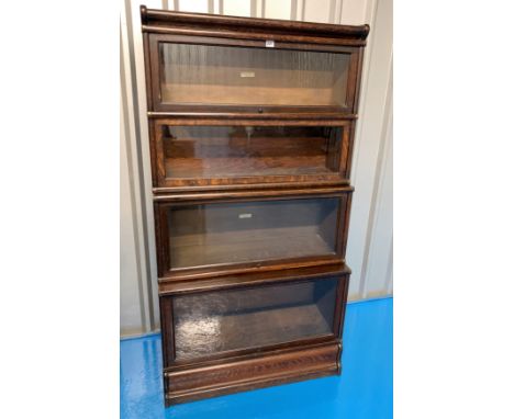 Globe Wernicke 4 section bookcase. 34” wide x 15” deep (base) x 65” high