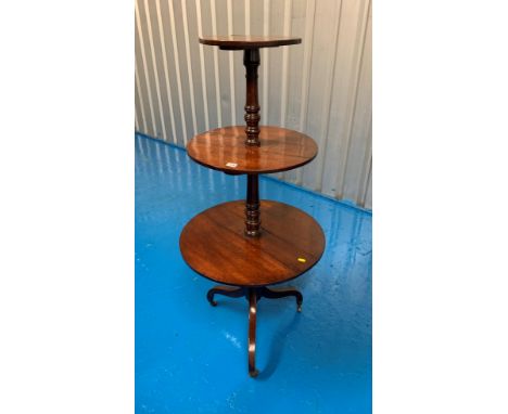 Triple dropleaf revolving tables on tripod legs with turned middle. 53” high