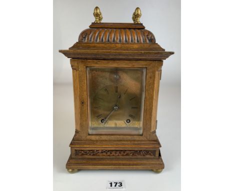 Oak brass faced 2 hole mantle clock with glass sides and with pendulum. 12.5” high x 7.5” wide