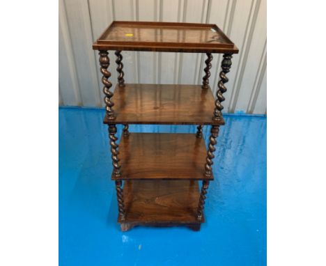 Rosewood whatnot of four tiers and barley sugar twist uprights between trays and standing on a bracket shaped plinth with ori