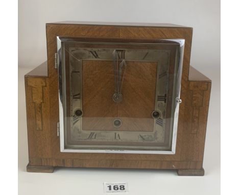 Art deco style square walnut mantle clock with 3 winding holes and pendulum. 10” long x 8.5”. Working