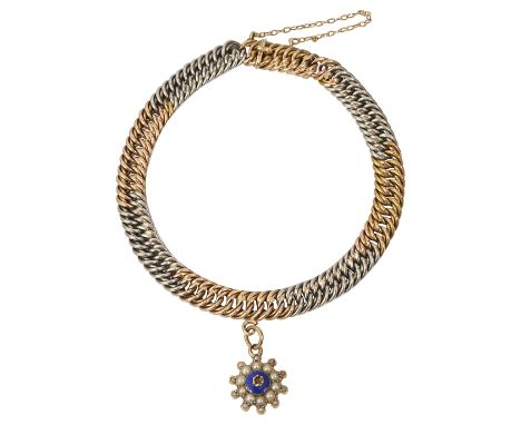 An Edwardian 15ct two coloured gold double curb link braceletthe clasp tongue stamped '15ct', length 20.5 cms,  suspending a 