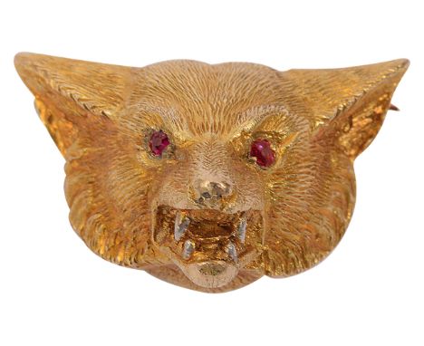 A 9ct yellow gold fox broochwith set ruby eyes and snarling expression exposing teeth, stamped on the reverse A &amp; W and 9