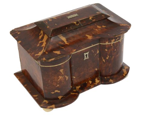 A late Regency tortoiseshell and ivory banded tea caddy c.1830of sarcophagus form with serpentine outline, hinged  shallow do