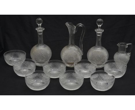 A late Victorian part suite of diamond cut table glasscomprising a pair of shaft and globe decanters and stoppers, a claret j