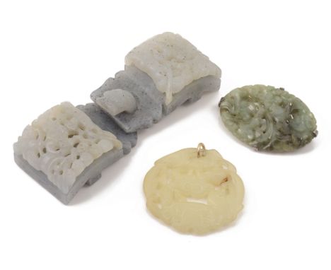 A large Chinese carved lilac jade two piece belt bucklepierced and carved with a central figure to each piece and having carv