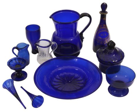 A collection of mostly late 18th/ early 19th century Bristol blue glass to include a late 18th century spirit decanter and st