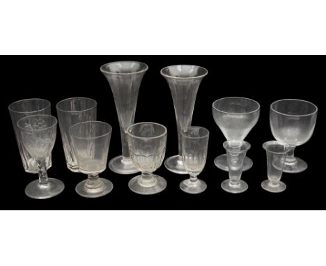 A late 18th century engraved wine glass c.1790 and selection of 19th century rummers and other glass first having round funne