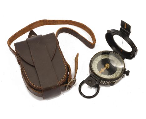 An early 20th century Negretti and Zambra prismatic compass lacquered case fitted with a suspension ring, silvered ring, in a