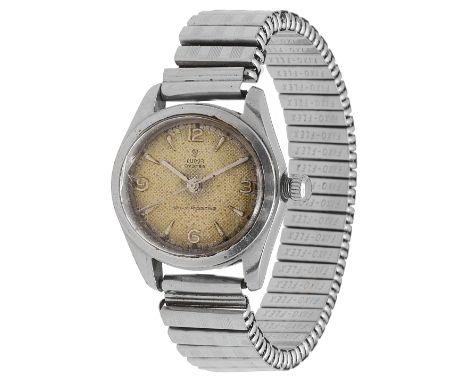 A mid century stainless steel Tudor Oyster wristwatchwith engine turned dial with raised Arabic and baton numerals, screw dow
