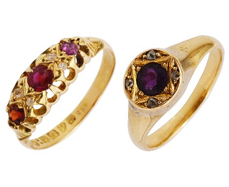 An Edwardian ruby, diamond-set and 18ct yellow gold, the three graduated rubies separated by two pairs of old-cut diamonds, C