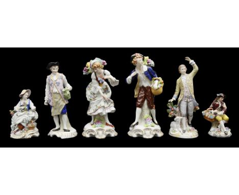 A collection of Sitzendorf porcelain figuresSitzendorf figures: a pair of of fruit pickers, a shepherd, a figure of a man hol