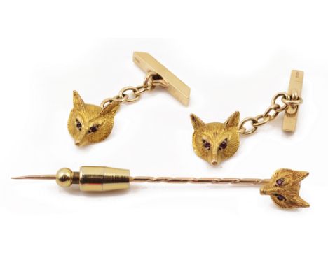 A pair of 9ct gold fox mask head cufflinks and a fox tie pinwith realistically chased heads and inset ruby eyes with chains a