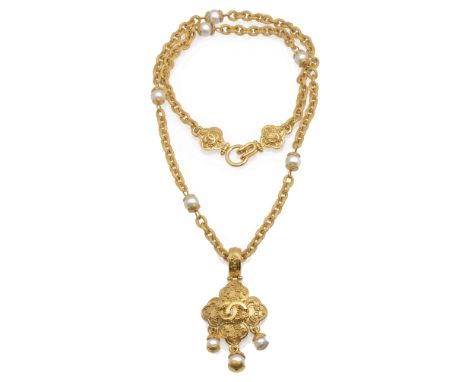 A vintage Chanel simulated pearl and gold tone pendant and chain, c. 1996, CC logo to chain and pendant, with berry motif, th