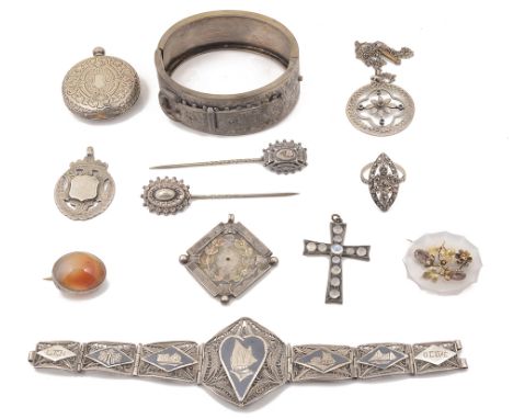 A collection of 19th century and later silver and costume jewellery, comprising a filigree panel bracelet, with design of boa