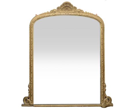 A Victorian giltwood and gesso overmantel mirror the original arched mirror plate, surmounted by a shell and scroll crestpiec