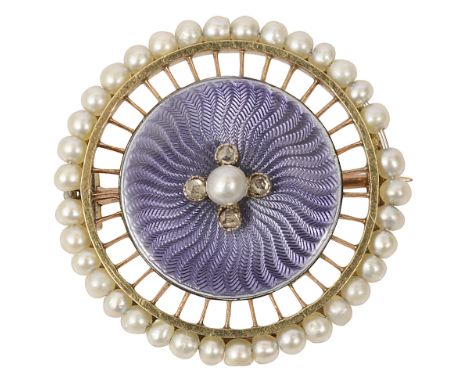 An early 20th century enamel and seed pearl brooch, of circular openwork design, the mauve guillochŽ enamelled plaque with a 