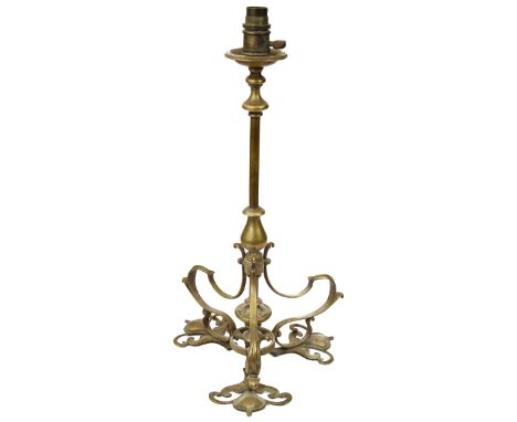 An Art Nouveau brass table lamp by F &amp; C. OSLER c.1900whiplash foliate scroll tripod basestamped OslerDoes not sit comple