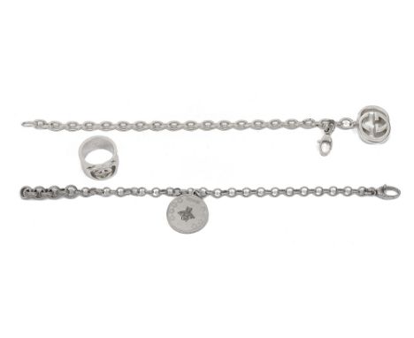 Three pieces of Gucci jewellery, including;a silver Interlocking G ring and a silver Interlocking G chain bracelet, both bear