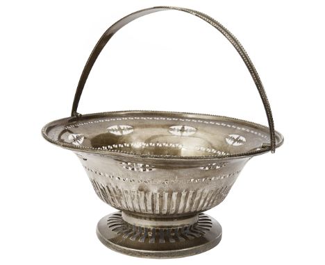 An Edwardian silver swing handled basketChester, 1911 by Hamilton &amp; Co.of circular pierced design, with beaded rim, on ci