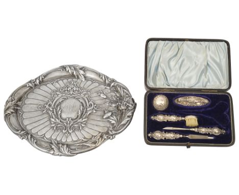 An Edwardian Art Nouveau silver embossed dressing table tray and a late Victorian cased manicure setfirst London, 1907 by Rob