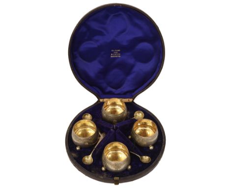 A cased set of four Victorian saltsSheffield, 1874 by Henry Wilkinson &amp; Co.of flat bottomed cauldron form, on ball feet, 