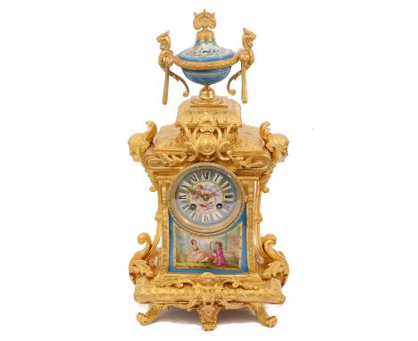 A late 19th century French Louis XVI style ormolu and Sevres style porcelain mounted mantle clockcircular blue ground porcela