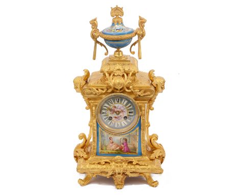 A late 19th century French Louis XVI style ormolu and Sevres style porcelain mounted mantle clockcircular blue ground porcela