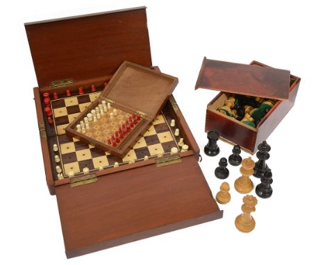 An early 20th century English 'Whittington' pattern travelling chess set in the manner of Jaques, with pegged carved bone red