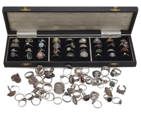 A collection of ninety four 20th century silver and white metal rings, several gem set examples, varying designs including; m