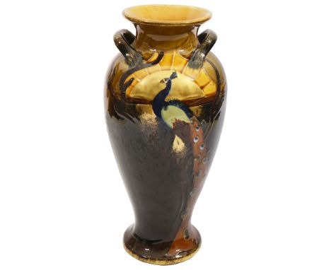 An early 20th century twin handled vase believed Thomas Forester &amp; Sons Phoenix Ware with arts and crafts peacock design,