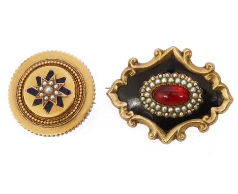 Two Victorian broochesone a black enamel memorial scroll brooch with seed pearl central frame, set with a red amber oval cabo