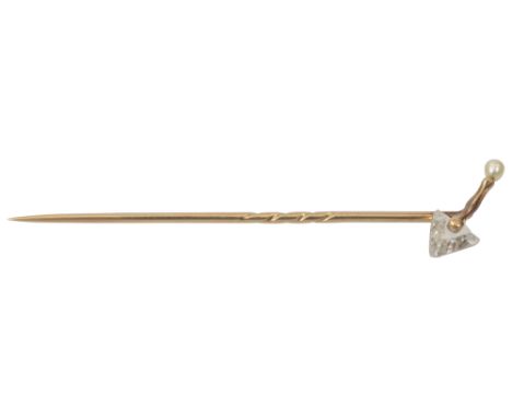 An unusual late Victorian/ Edwardian diamond and pearl stick pin, modelled as a trowel, with triangular diamond blade and pea