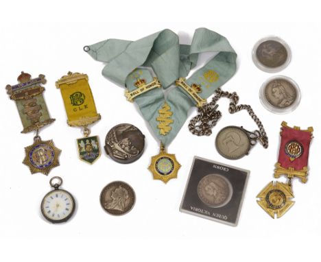 A silver double Albert curblink watch chain, silver crowns and coins, an open faced silver fob watch and various medalsthe wa